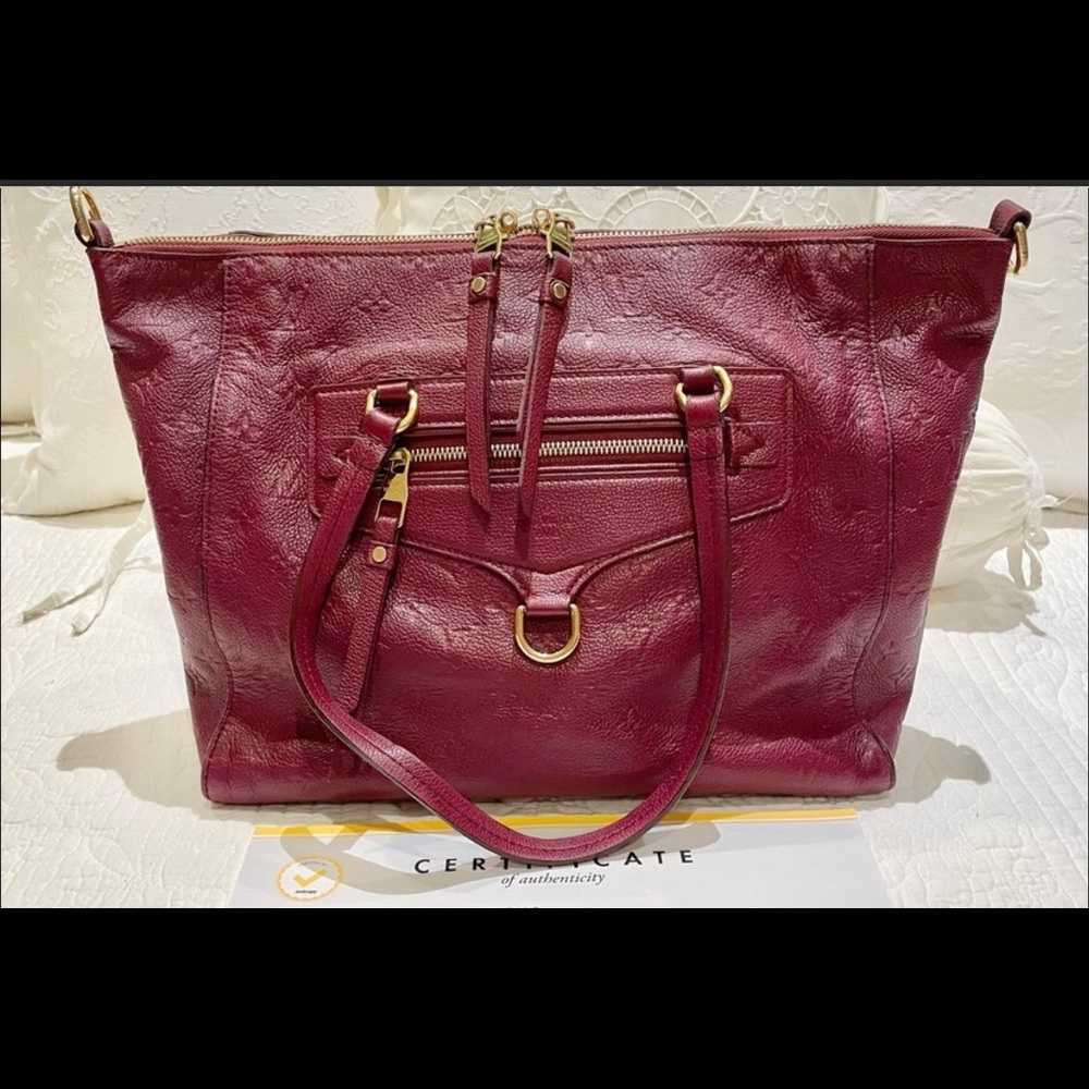 Authentic Loius Vuitton Lumineuse  Empriente Leather in Aurore color.